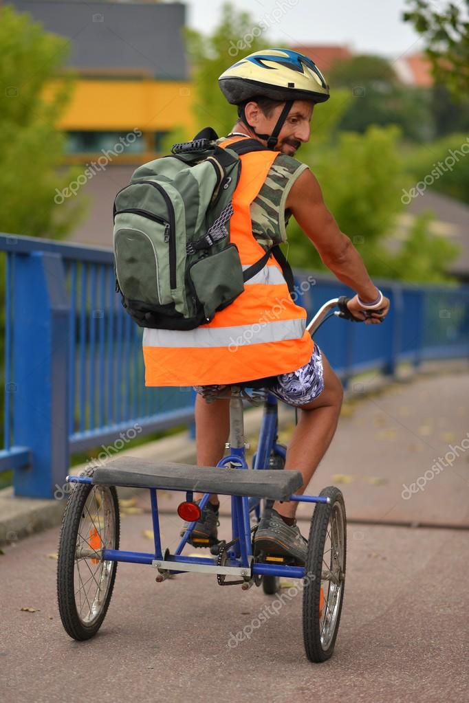 Man on tricycle Man Riding Tricycle — Stock Photo © muro 30925855