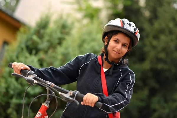 Woman with bicycle — Stock Photo, Image