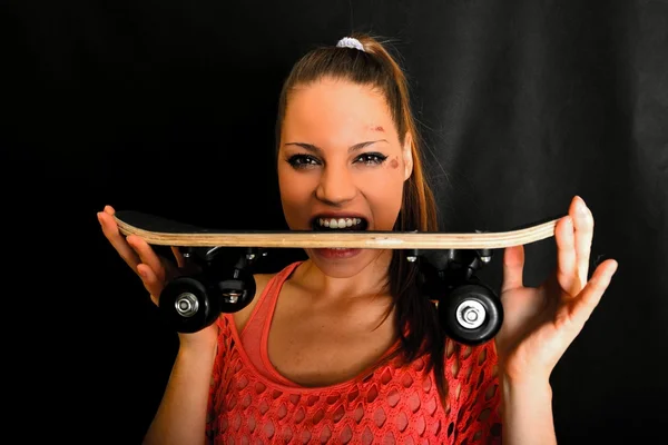 Portrait of beautiful extreme girl with skateboard — Stock Photo, Image