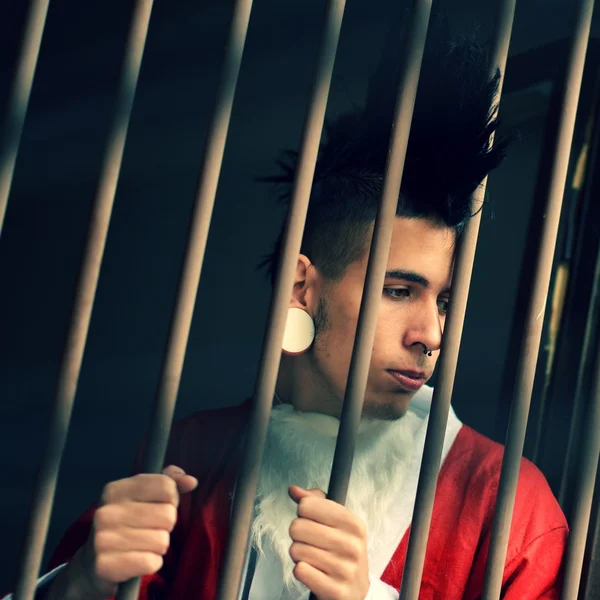 Santa Claus is behind bars in jail — Stock Photo, Image