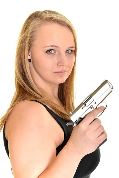 Young beautiful woman holding a gun — Stock Photo, Image