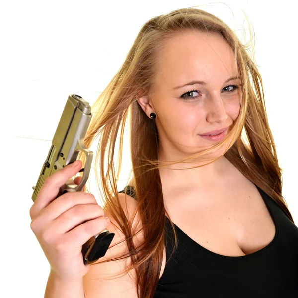 Young beautiful woman holding a gun — Stock Photo, Image