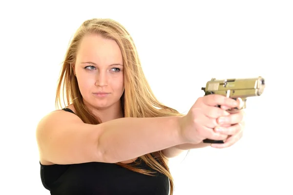 Young beautiful woman holding a gun — Stock Photo, Image