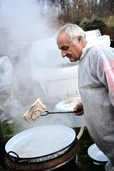 Man boiling meat — Stock Photo, Image