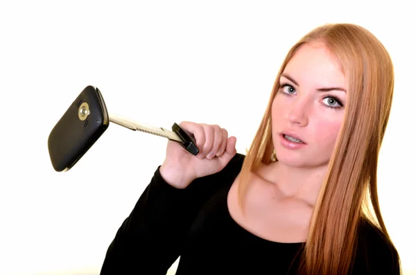 Blond girl with knife and damaged phone — Stock Photo, Image
