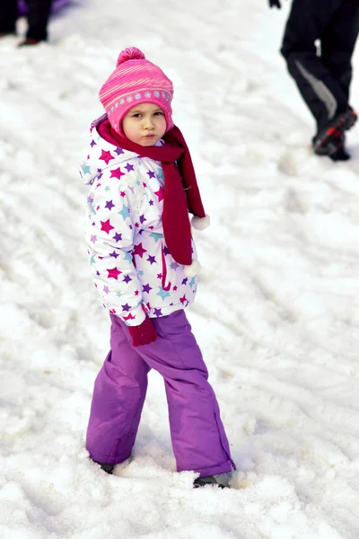 Portrait of happy girl in winter fun, snow, family sledding — Stock Photo, Image