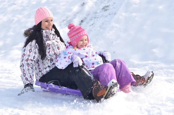 Winter fun - family sledding — Stock Photo, Image