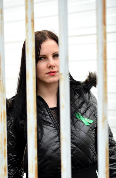 Woman behind the bars — Stock Photo, Image
