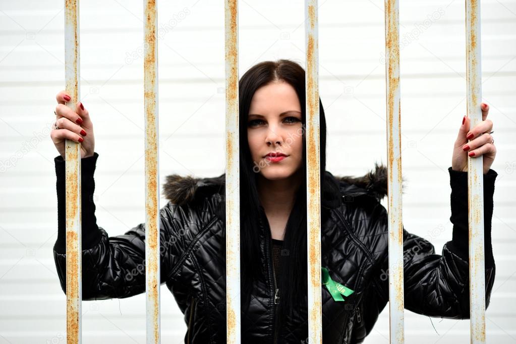 Woman behind the bars