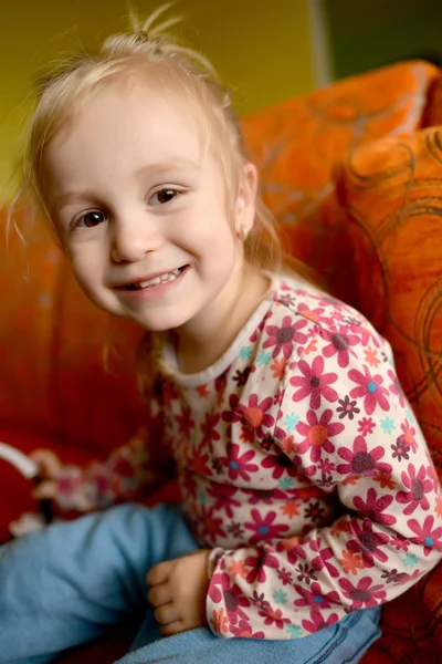 Girl on sofa — Stock Photo, Image