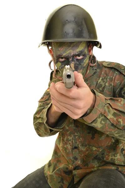 Soldier man holds gun — Stock Photo, Image