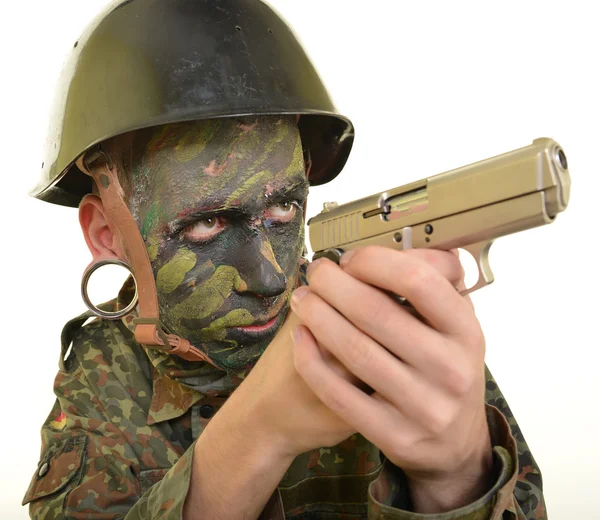 Soldier man holds gun — Stock Photo, Image