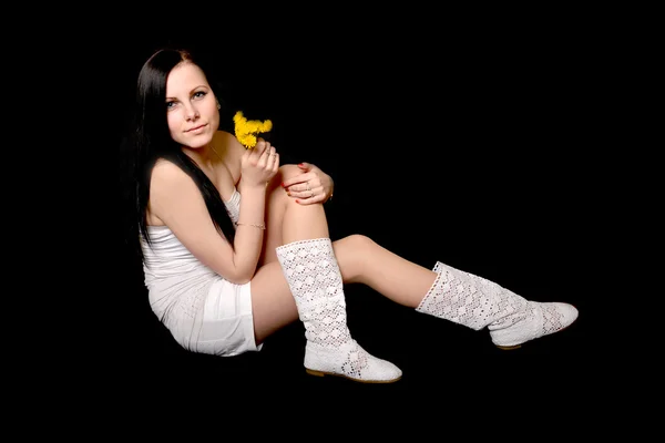 Woman holding dandelions — Stock Photo, Image