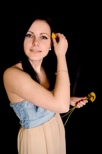 Woman and dandelions — Stock Photo, Image