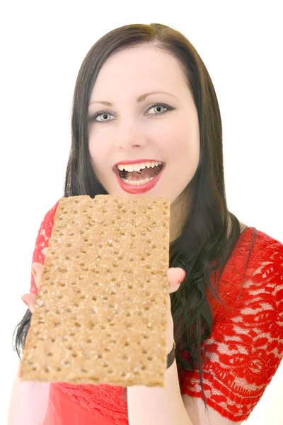 Mulher comendo pão crocante — Fotografia de Stock