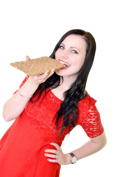 Mulher comendo pão crocante — Fotografia de Stock