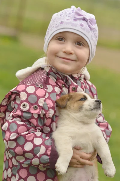 Little girl with her puppy — Stock Photo, Image