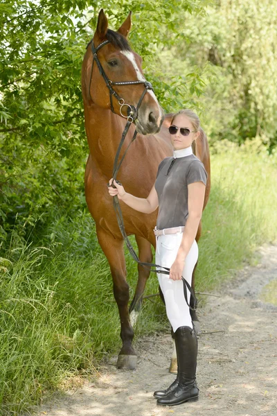 Woman with horse — Stock Photo, Image