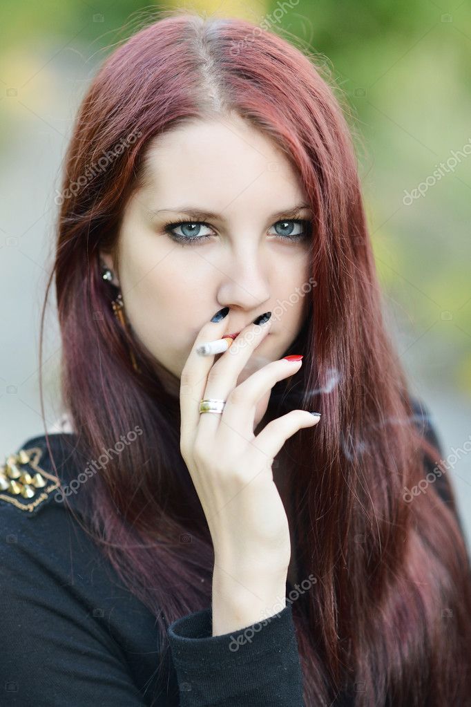Woman Smoking a Cigarette — Stock Photo © muro 49384971