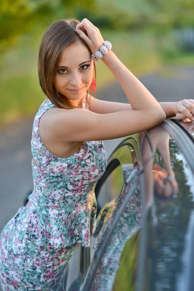 Happy young driver standing by car — Stock Photo, Image