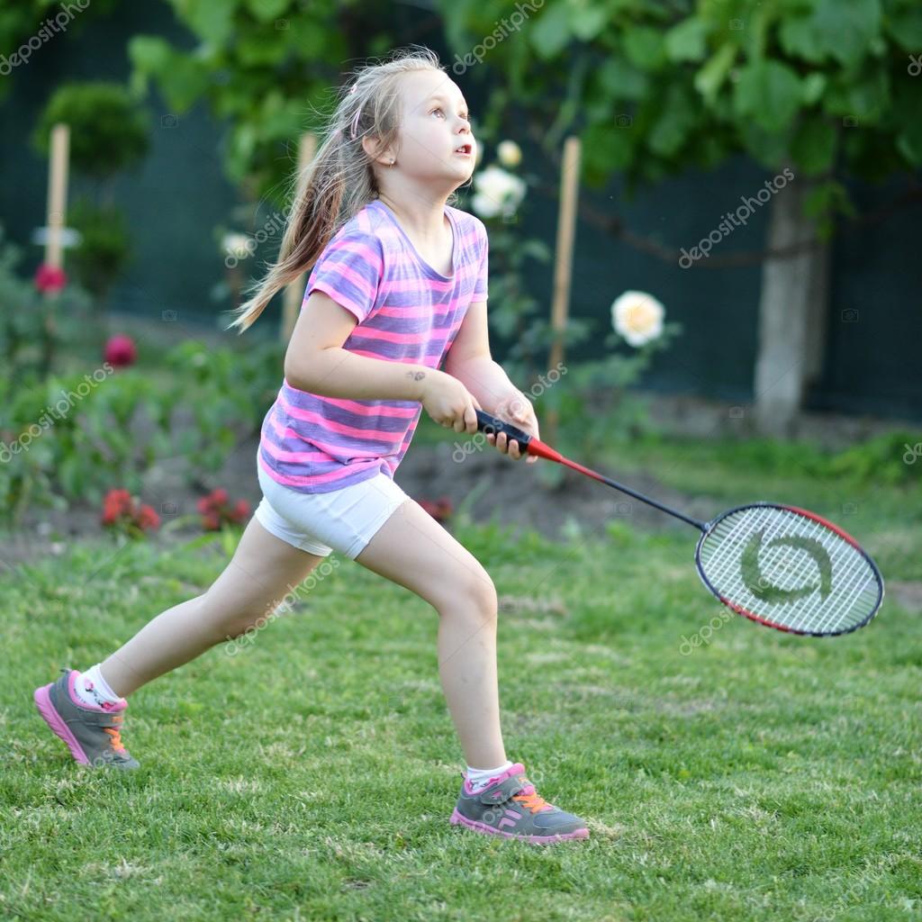 Cute little girl playing badminton — Stock Photo © muro 49391591