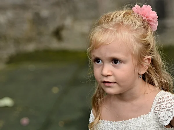 Little bridesmaid in playground — Stock Photo, Image