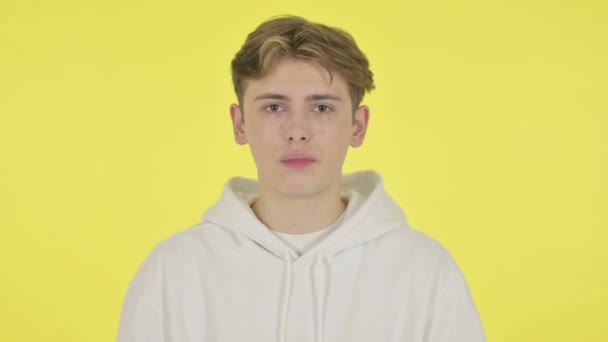 Shocked Young Man on Yellow Background — Stock Video