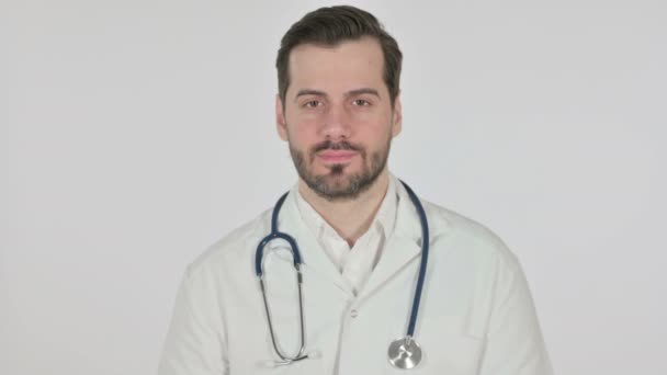 Portrait of Attractive Doctor Smiling at Camera, White Screen — Stock video