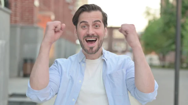 Excited Man Celebrating Success while Standing Outdoor — Stock Photo, Image