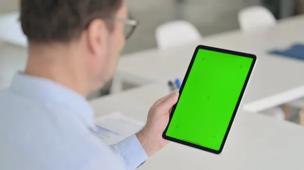 Middle Aged Man using Tablet with Green Chroma Screen — Stock Photo, Image