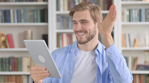 Portrait of Man Waving for Video Call on Tablet — стоковое фото