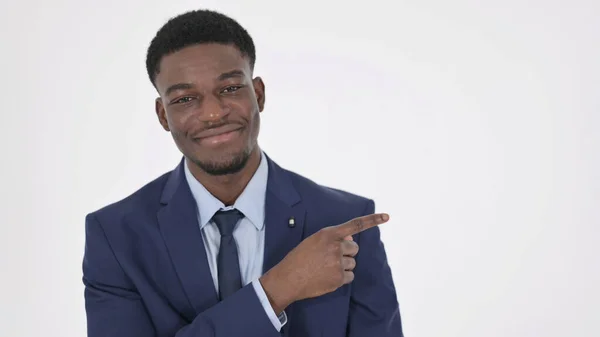 Confident African Businessman Pointing on Side, White Background — Stock fotografie