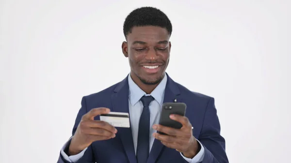 African Businessman with Successful Online Shopping on Smartphone on White Background — 图库照片