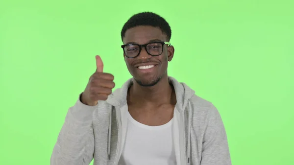 African Man showing Thumbs Up on Green Background — Stock Fotó