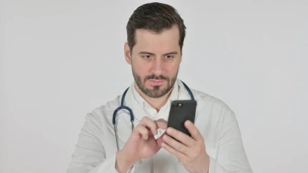 Portrait of Doctor using Smartphone, White Screen — стоковое фото
