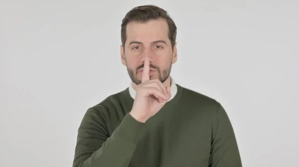 Retrato del hombre poniendo dedo en los labios, silencio, pantalla blanca —  Fotos de Stock