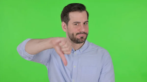 Portrait of Man showing Thumbs Down Gesture, Green Screen — Stockfoto