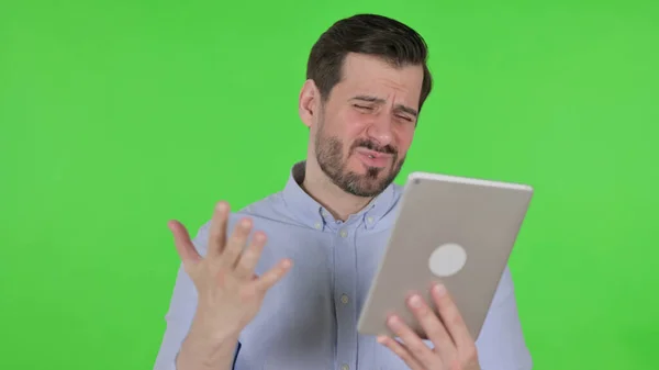 Portrait of Man having Loss on Tablet in Office, Green Screen — Stockfoto