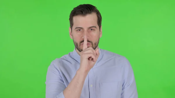 Portrait of Man Putting Finger on Lips, Silence, Green Screen — Photo