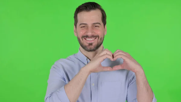 Portrait of Man showing Heart Shape by Hands, Green Screen — Stock Fotó