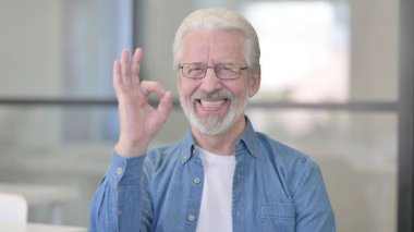 Portrait of Senior Old Man Showing Okay Sign