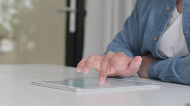 Close Up of Hand using Digital Tablet
