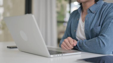Close Up of Man Counting Dollars while Working on Laptop
