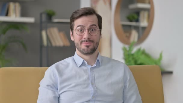 Portrait of Young Man showing OK Sign at Home — Stock Video