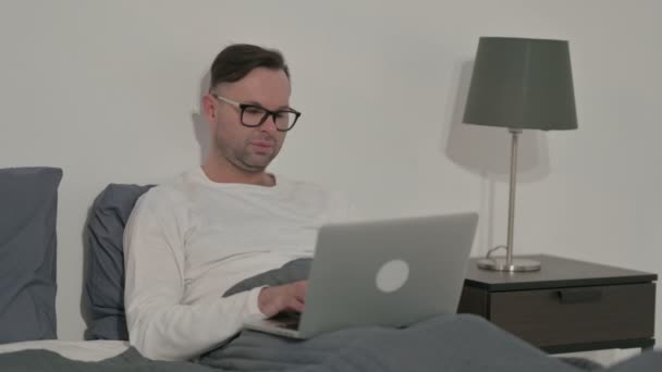 Middle Aged Man Having Back Pain While Using Laptop Bed — Stockvideo