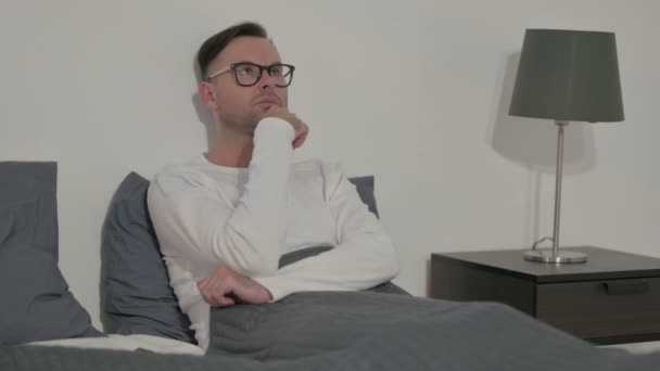 Pensive Middle Aged Man Thinking While Sitting Bed — Video