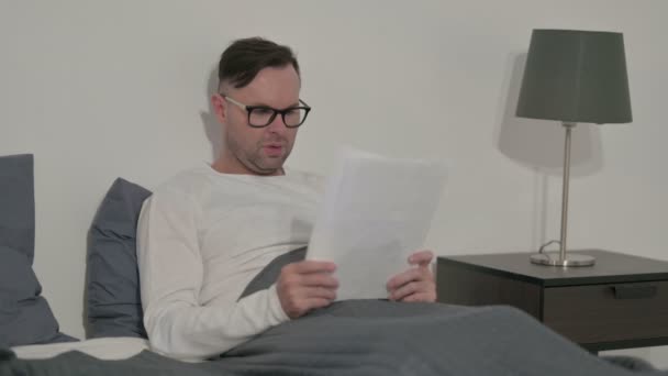 Middle Aged Man Having Success Documents While Sitting Bed — 비디오