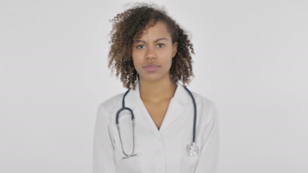 Serious African Lady Doctor Looking Camera White Background — Stockvideo