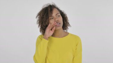 African Woman Trying to Listen Secret on White Background