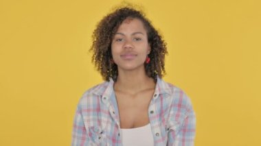 African Woman Pointing at Camera, Inviting on Yellow Background 